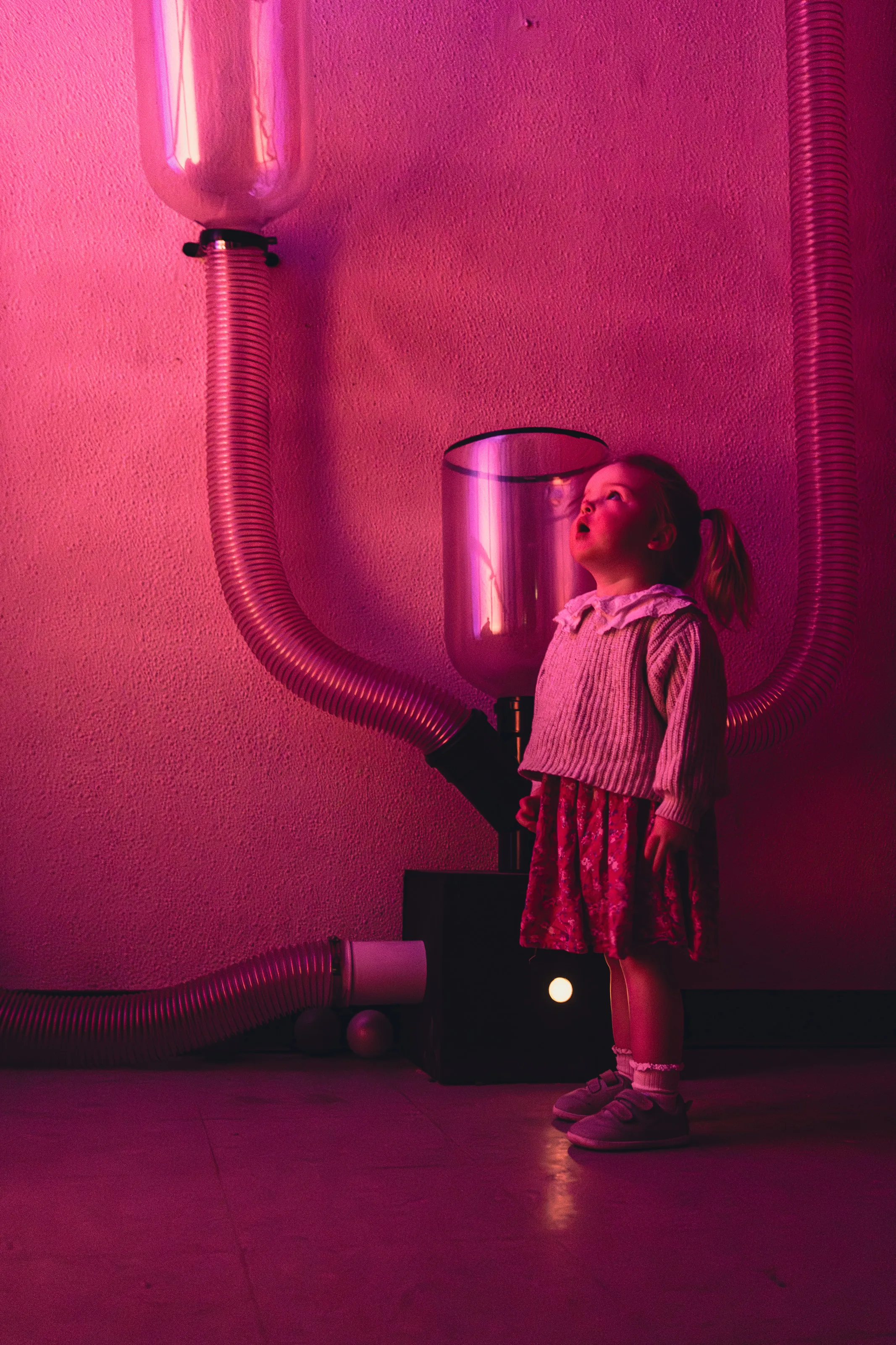 A child in the vacuum ball room\