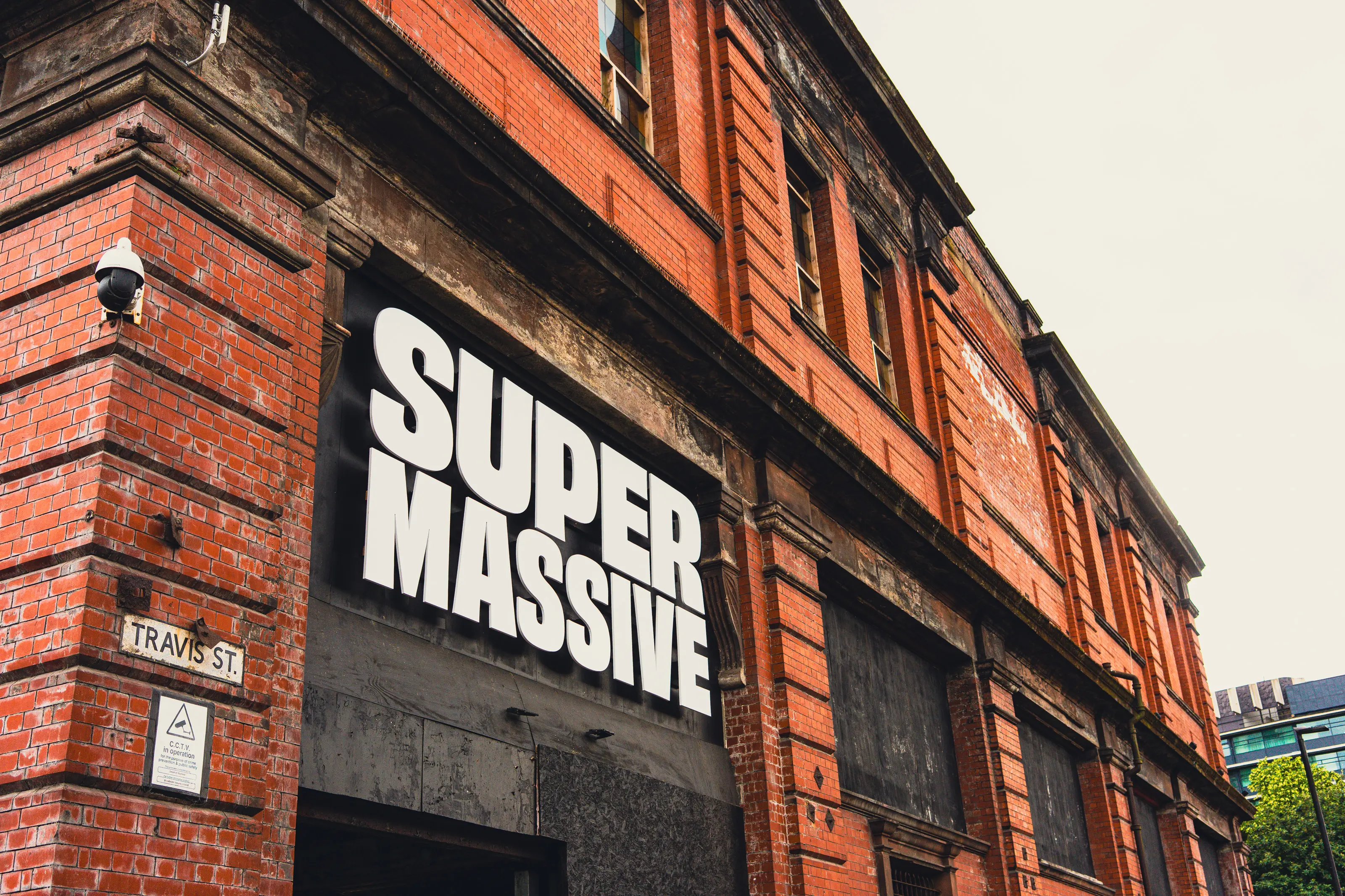 Wide opening-night view of the Depot Mayfield venue with interactive installations lit across the space