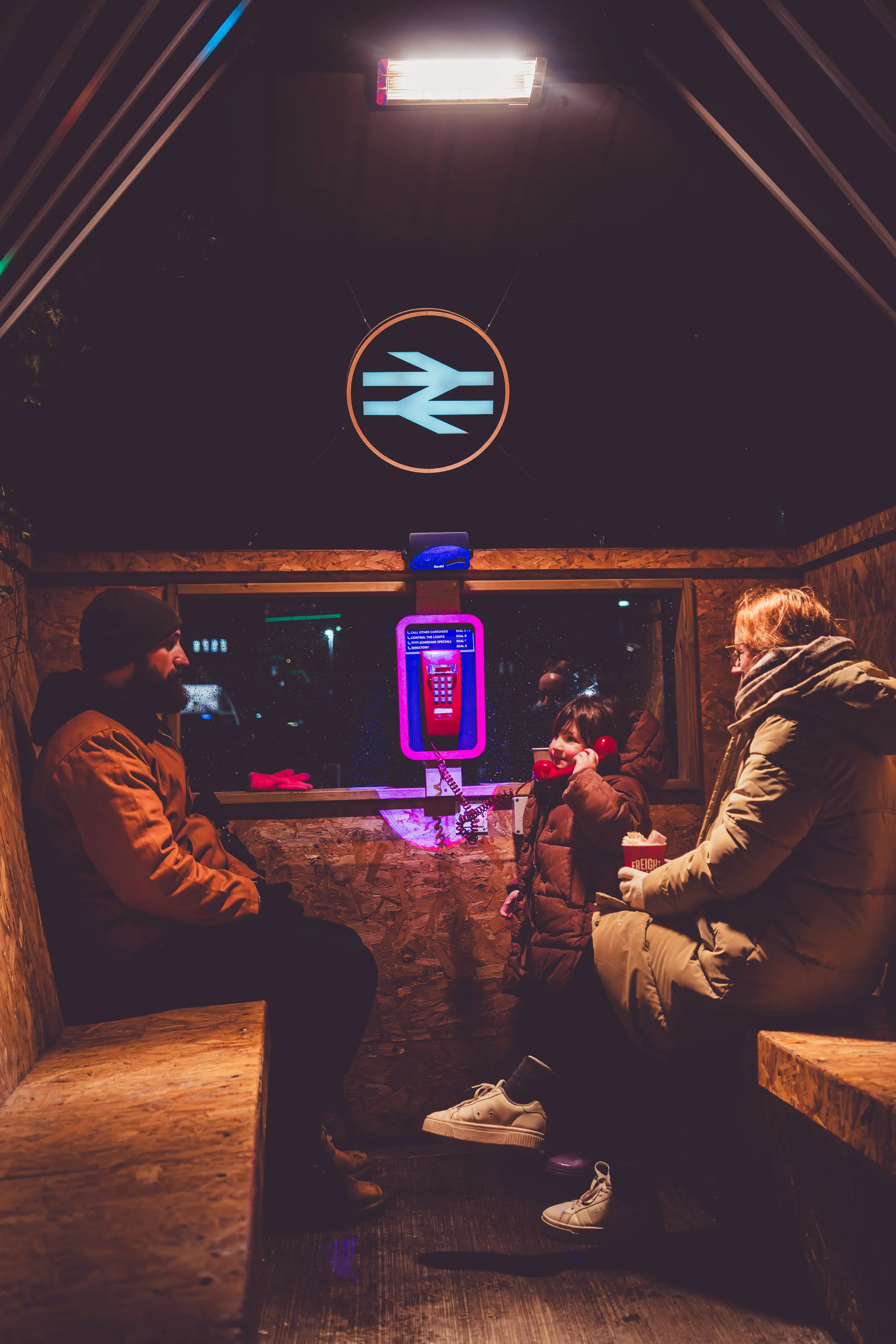 Twilight Tales portrait showing a visitor mid-conversation with the phone-based narrative system