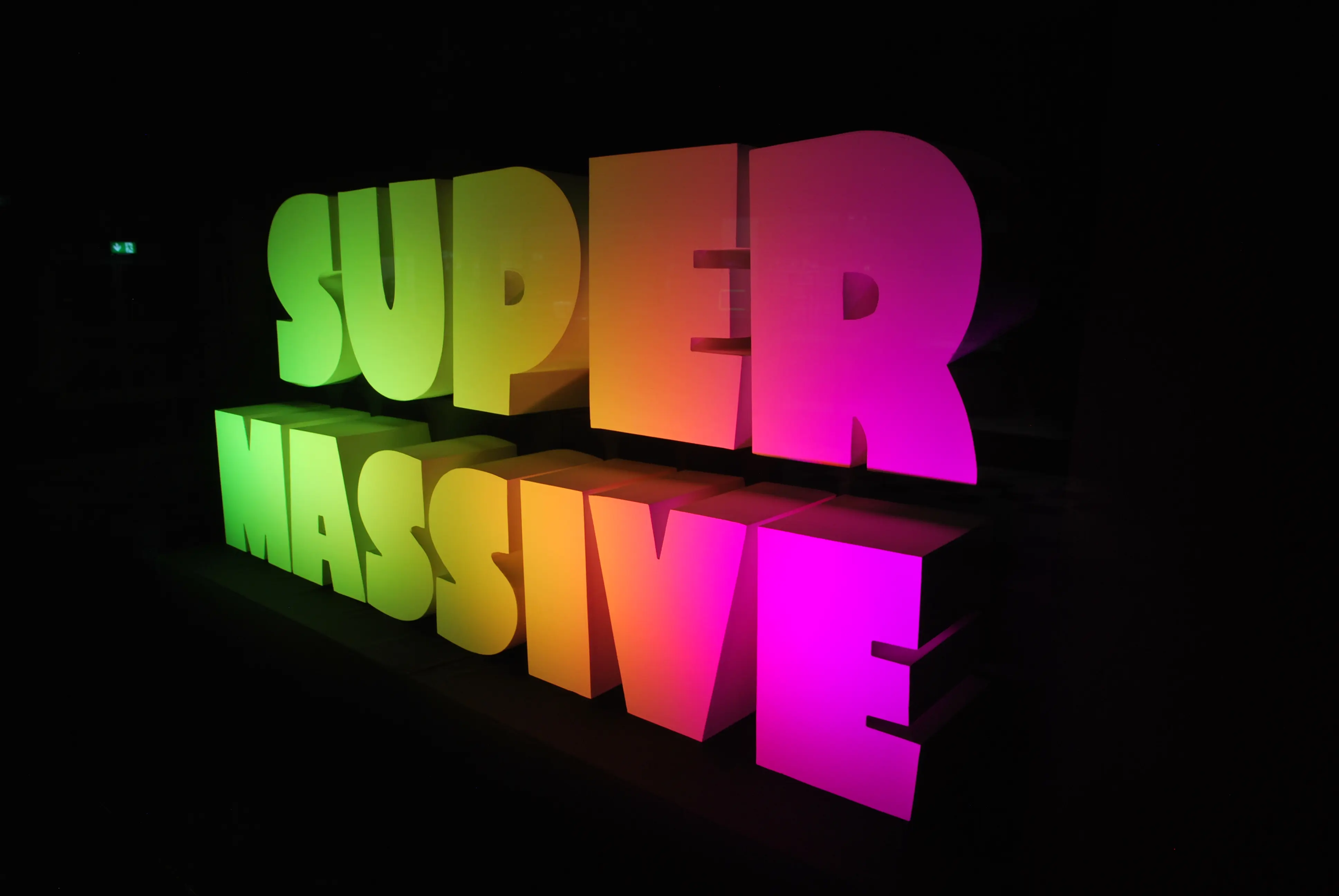 Visitors moving between interactive stations in the converted high-street space