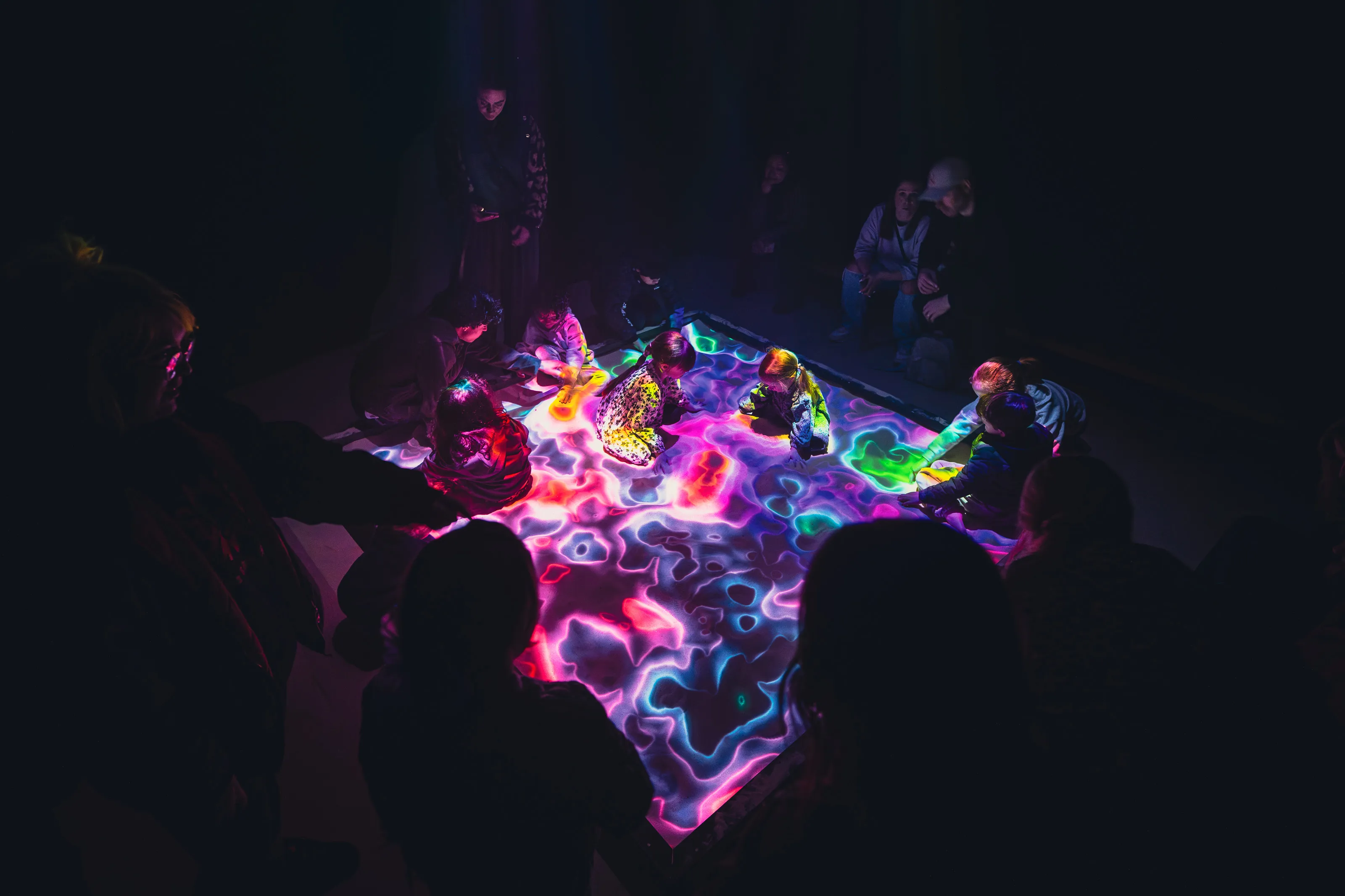 Children play in the augmented reality sandpit